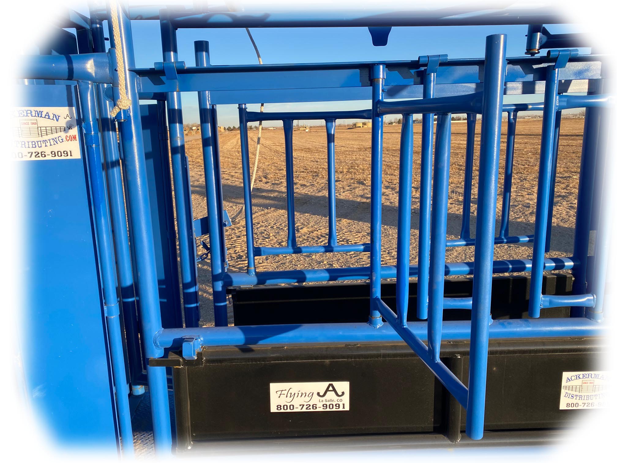 The Flying A Side Exit Cattle Squeeze Chute w/ Manual Headgate & Split Rear Tailgate